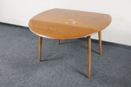 An Ercol elm drop leaf table