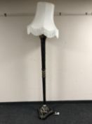 A hardwood and gilt standard lamp with shade