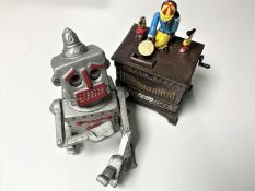 Two cast iron novelty money boxes;