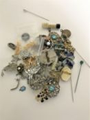 Two boxes of costume jewellery - brooches, necklaces, cross,