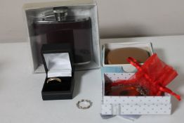 A 9ct gold band ring, Chinese amber coloured pendant, silver ring, a cased travel clock,