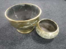 A Chinese style embossed brass planter with bird decoration,