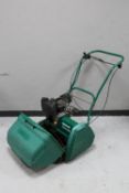 A Qualcast classic petrol 43S self drive lawn mower with box