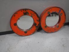 A pair of oil drum topped mirrors
