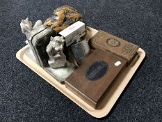 A tray containing a pair of pottery gargoyle bookends, polished piece of burr walnut,