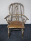 An antique elm Windsor armchair
