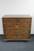 A Victorian walnut five drawer chest on bracket feet