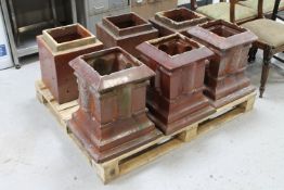 A set of three antique glazed chimney pots
