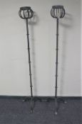 A pair of wrought iron torcheres
