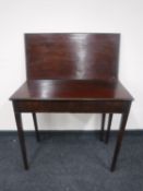 A 19th century mahogany turnover top tea table
