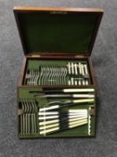A Victorian mahogany canteen containing silver plated and stainless steel cutlery