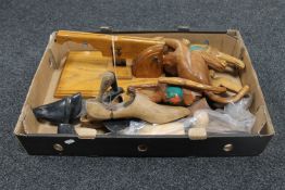 A box containing vintage wooden shoe stretchers,