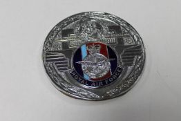 A vintage Royal Air Force car badge