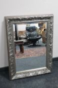 A silvered framed Art Nouveau style bevelled mirror