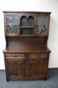 A Jaycee oak leaded glass door dresser CONDITION REPORT: Handle missing.