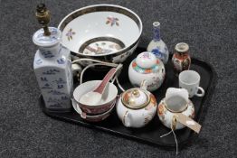 A tray containing Oriental wares including blue and white glazed table lamp,