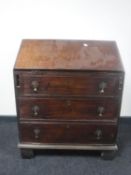A George III mahogany writing bureau of small proportions
