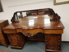 A Victorian mahogany mirror backed serpentine fronted twin pedestal sideboard, width 197 cm.