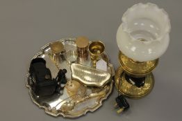 A silver plated tray with brass lamp and glass shade, silver plated purse, old brass pestle, lamp,