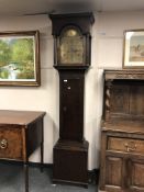 An oak eight day longcased clock with brass dial, height 220 cm.