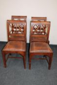 Four contemporary leather seated dining chairs