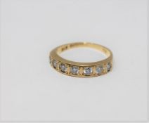An 18ct gold seven stone brilliant cut diamond ring, approximately 0.