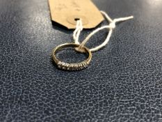 A 9ct gold and diamond half eternity ring