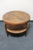 A circular two tier walnut Art Deco occasional table CONDITION REPORT: 79cm