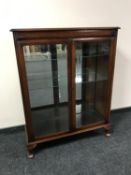 A double door mahogany display cabinet
