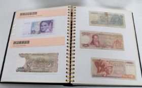 An International Currency Collection album containing banknotes of the World