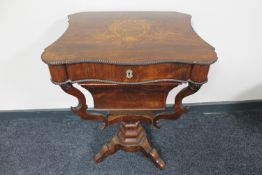A 19th century inlaid rosewood pedestal work table