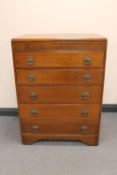A 1930's oak five drawer chest CONDITION REPORT: 102cm high by 76cm wide by 45cm