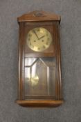 An early twentieth century oak cased wall clock with Junghans movement,