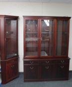 A contemporary inlaid mahogany triple door display cabinet fitted with cupboards and doors beneath