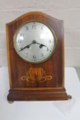 An early 20th century inlaid mahogany French mantel clock CONDITION REPORT: One foot
