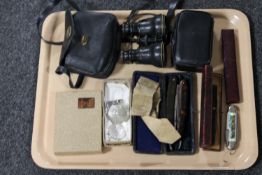 A tray containing vintage cut throat razors, set of 19th century field glasses in case,