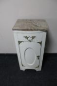 An antique painted pot cupboard with later marble top