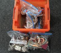 A box containing six bags of assorted costume jewellery