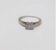 An 18ct white gold diamond set cluster ring, approximately 0.