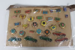 Thirty mid 20th century tin pin badges all relating to automobiles