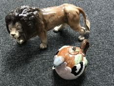 A china lion figure and a Staffordshire Ceramics garden birds chaffinch teapot