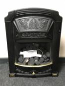 A cast metal brass coal effect gas fire