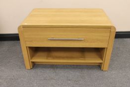 A contemporary television stand fitted with a drawer