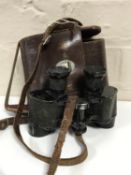 A pair of early 20th century leather cased G.