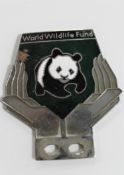 A World Wildlife Fund vintage car badge depicting a panda