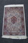 A Persian hearth rug,
