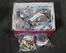 A box containing seven bags of assorted costume jewellery
