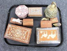 A tray of Eastern trinket boxes, brass bell,