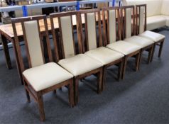 A set of fourteen sheesham wood cream leather upholstered dining chairs together with one other