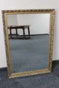 A gilt framed bevelled overmantel mirror